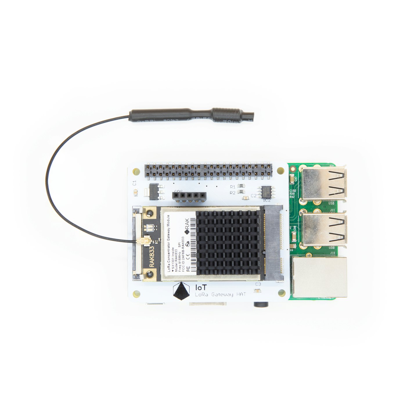 LoRa gateway electronic board with antenna and components on white.
